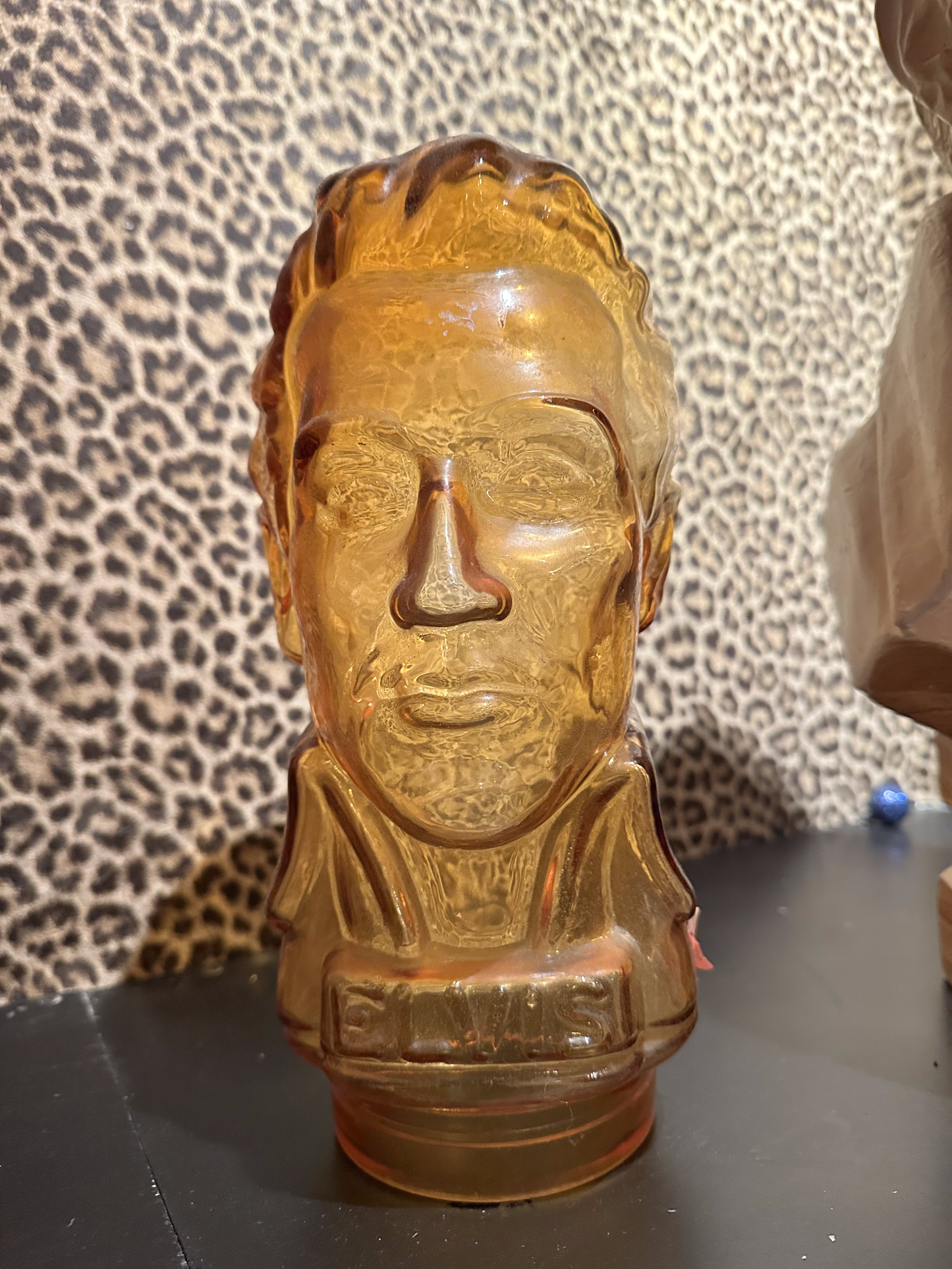 Medium Elvis Bust in Amber colored glass