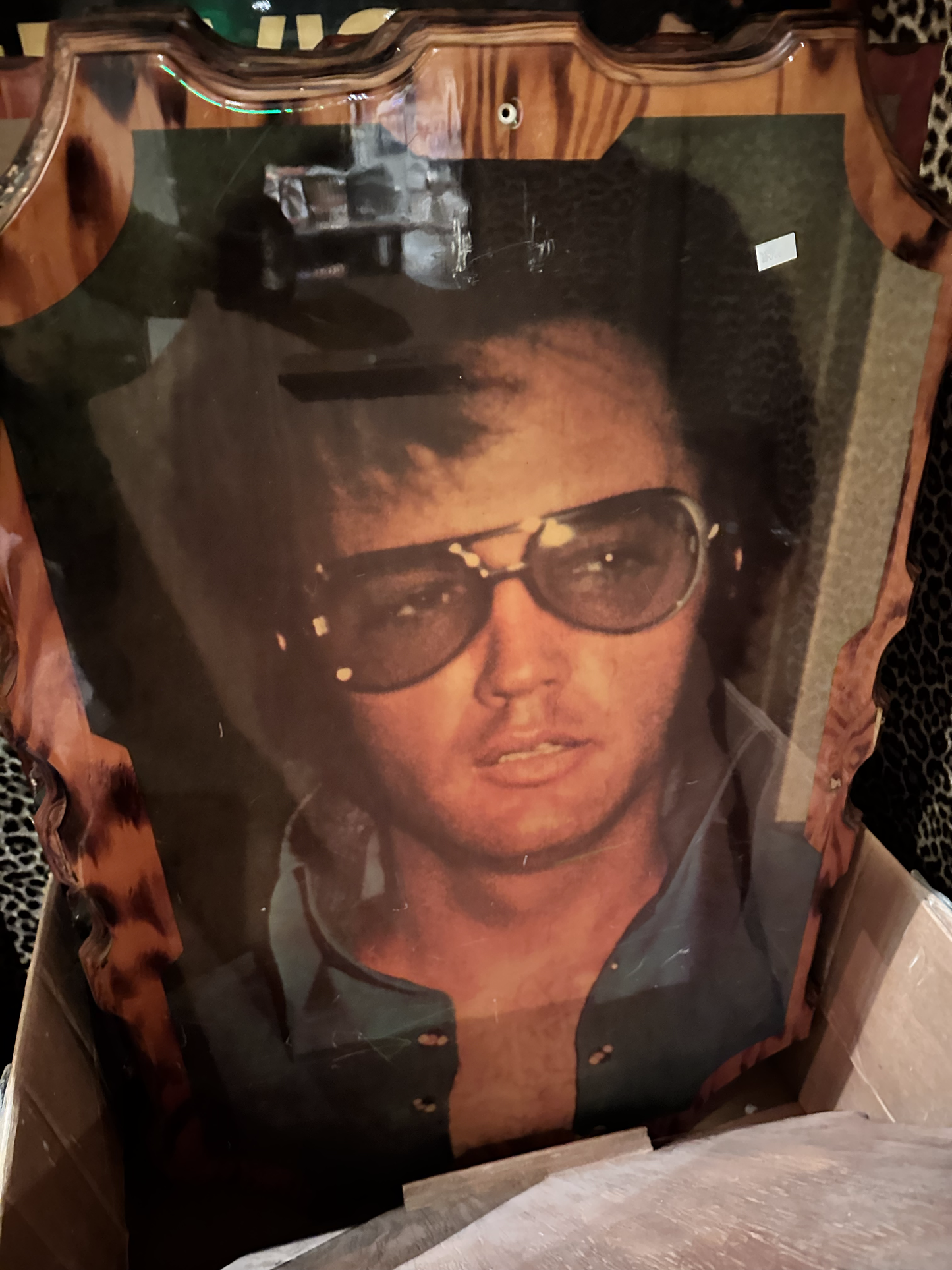 Large portrait of Elvis wearing sunglasses on Wood